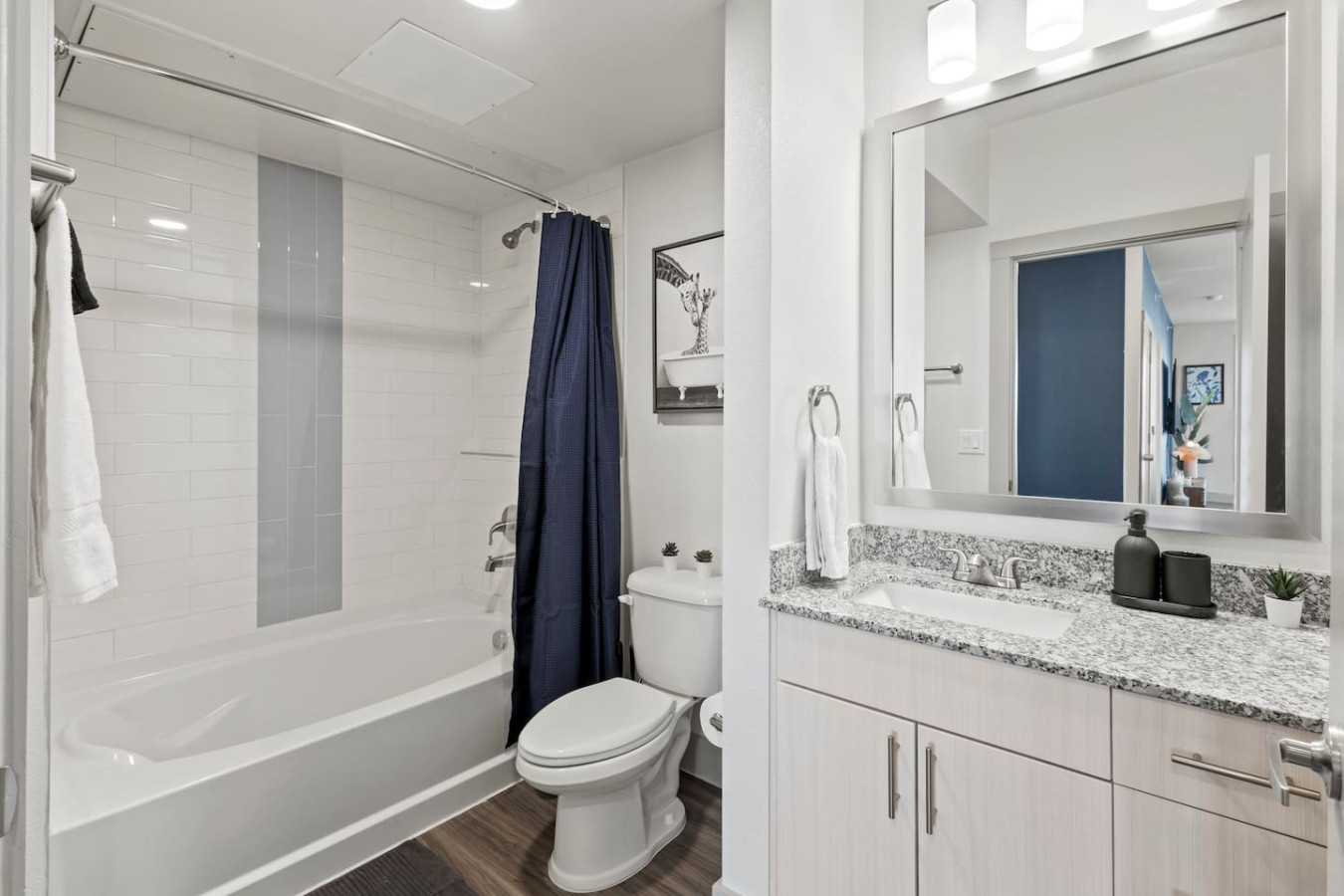 You feel a sense of calm as you enter the bathroom, where the thoughtful design and high-quality materials create a serene environment.