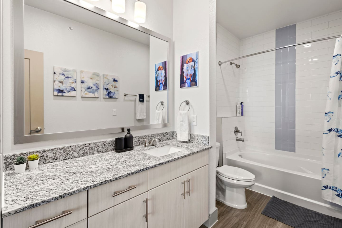 You feel a sense of calm as you enter the bathroom, where the thoughtful design and high-quality materials create a serene environment.