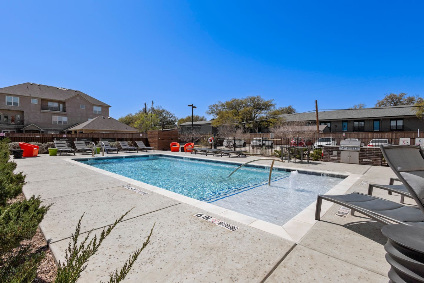You can imagine yourself lounging by the pool, surrounded by greenery and the gentle sound of water.