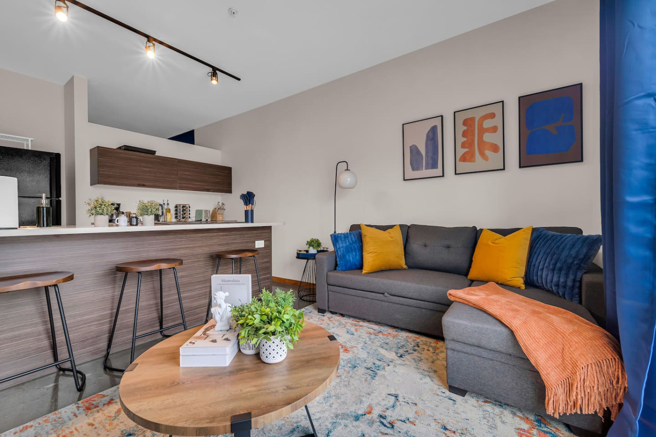 An open-concept area featuring a modern furnishings, and a stylish entertainment setup—ideal for gatherings and relaxation.