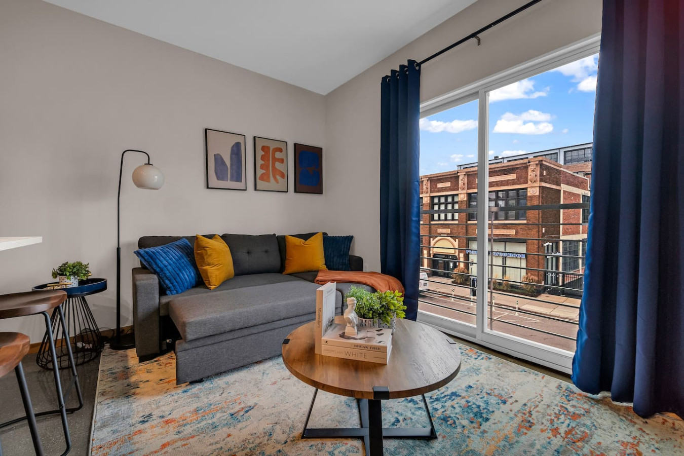 You feel a sense of peace as you step into the living room , with its inviting decor and soothing tones.