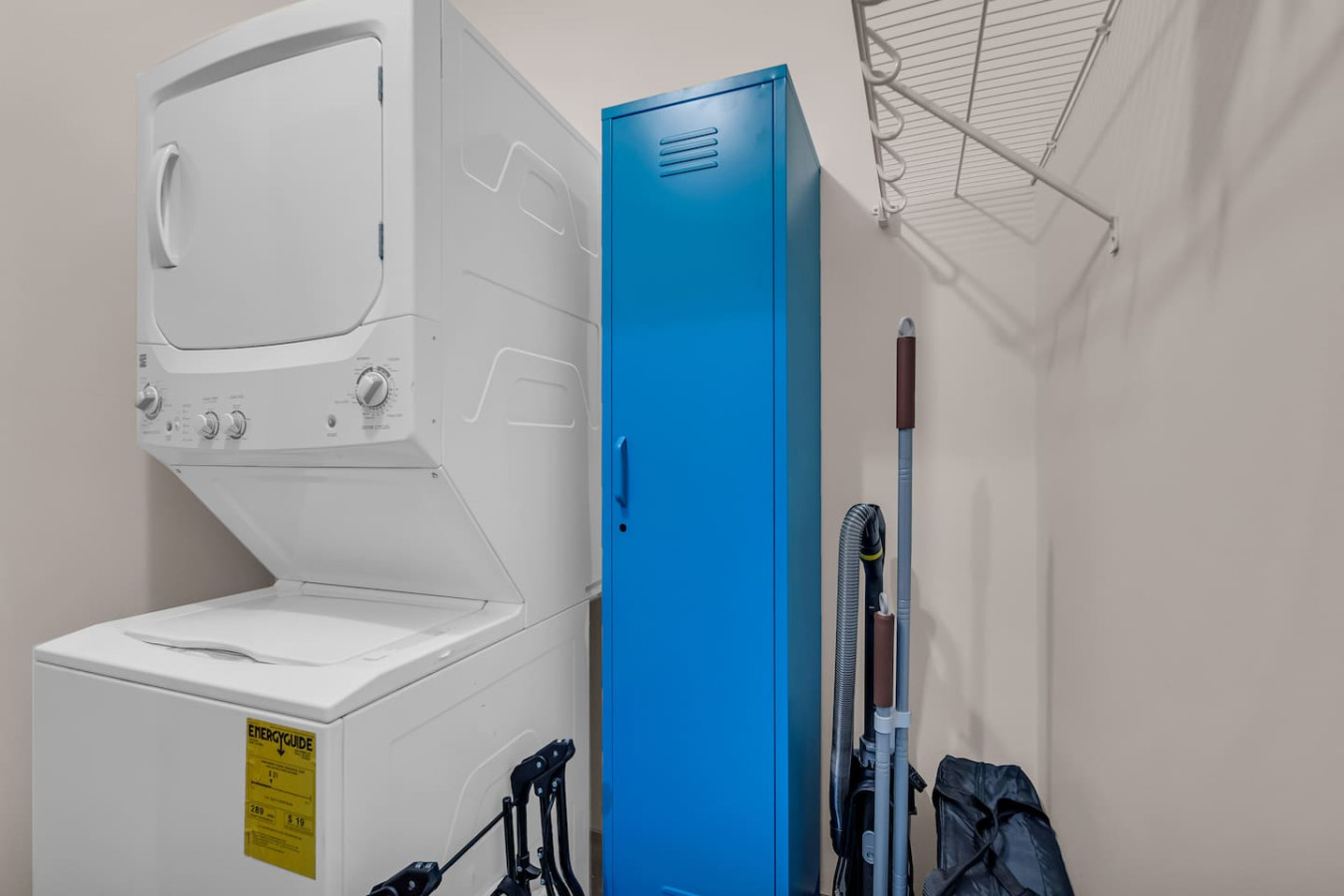 As you step into the laundry room, the modern appliances and ample storage space make it easy to keep things tidy.