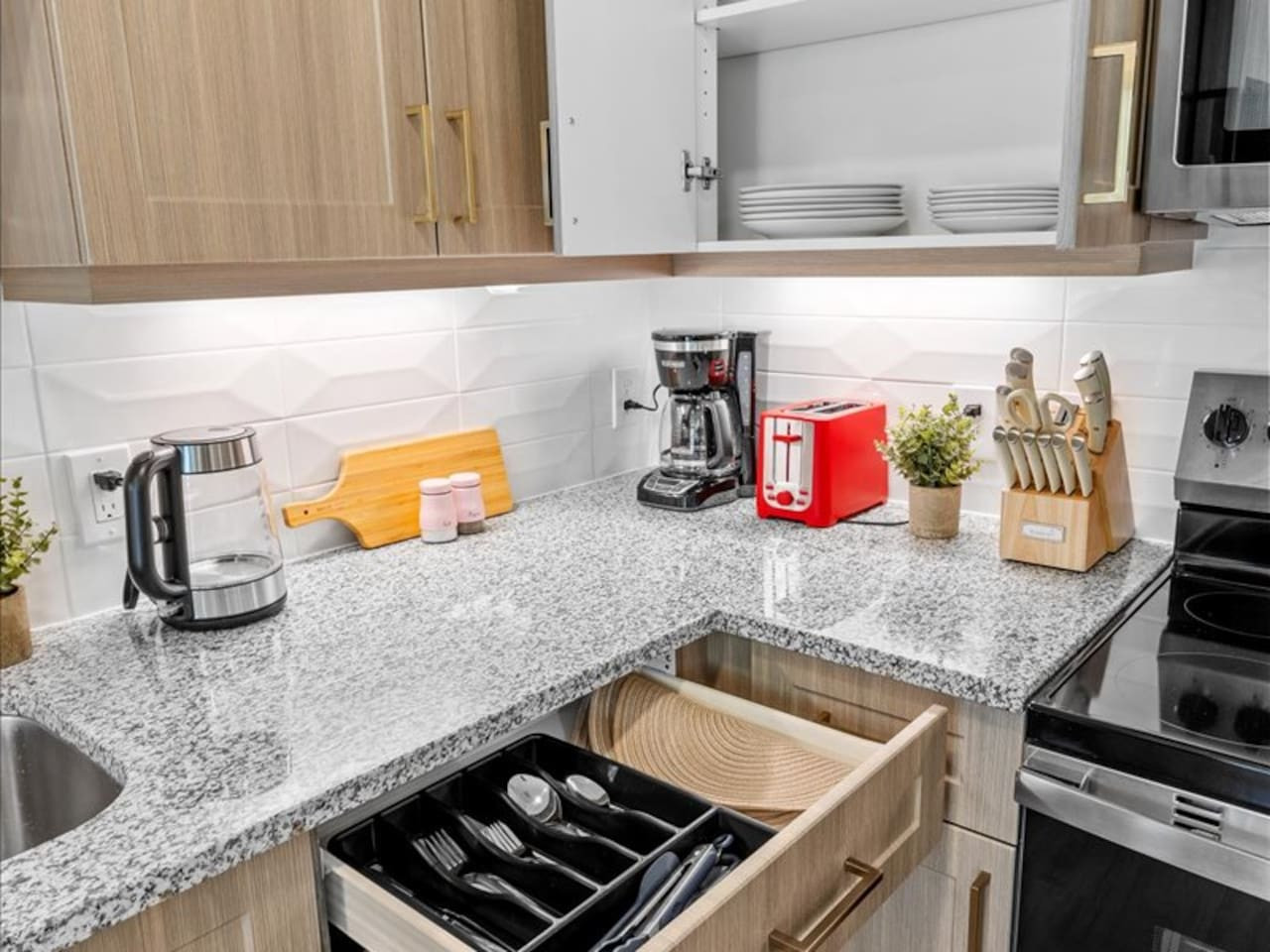 The kitchen invites you to experiment with new recipes, offering a stylish and practical space to cook and create.