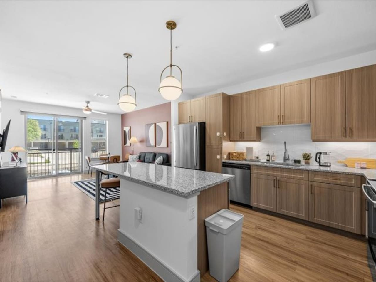 The kitchen’s open layout allows you to move freely as you prepare meals, with everything you need at your fingertips.