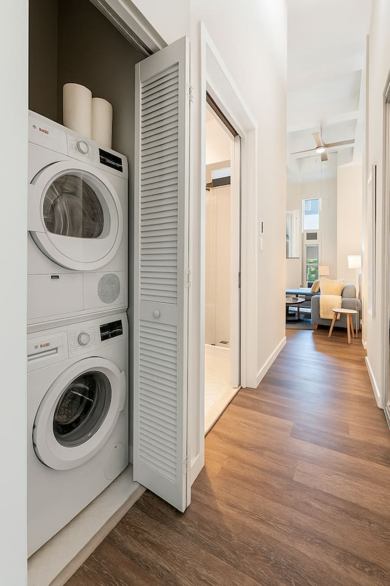 As you step into the laundry room, the modern appliances and ample storage space make it easy to keep things tidy.