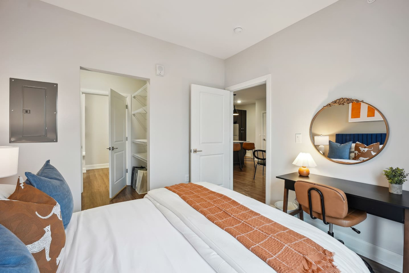 The bedroom offers a luxurious retreat, with a bed that promises restful nights and a room that feels like a private oasis.