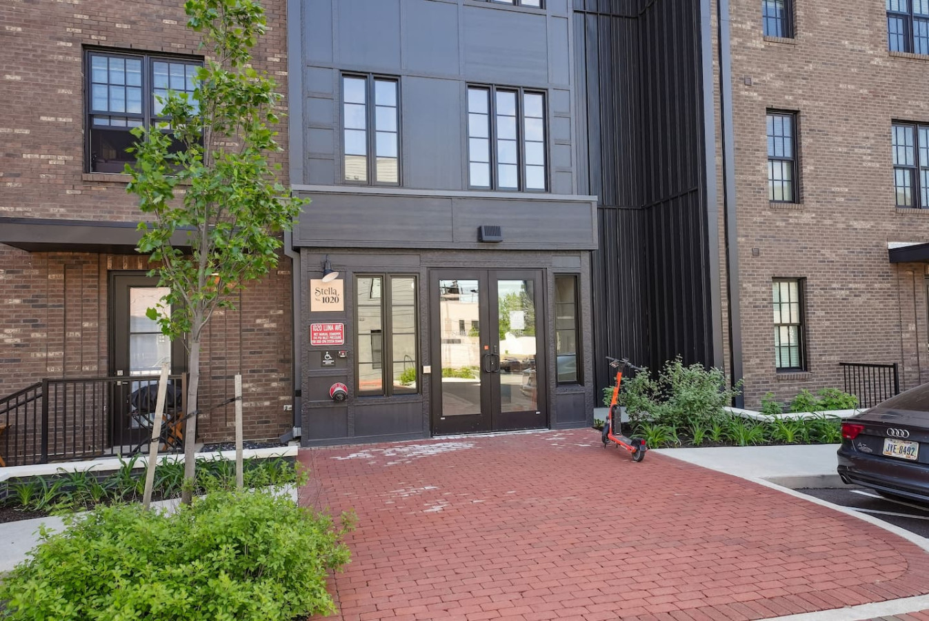 The outdoor area is a blend of modern and classic design elements, creating a welcoming and stylish facade.