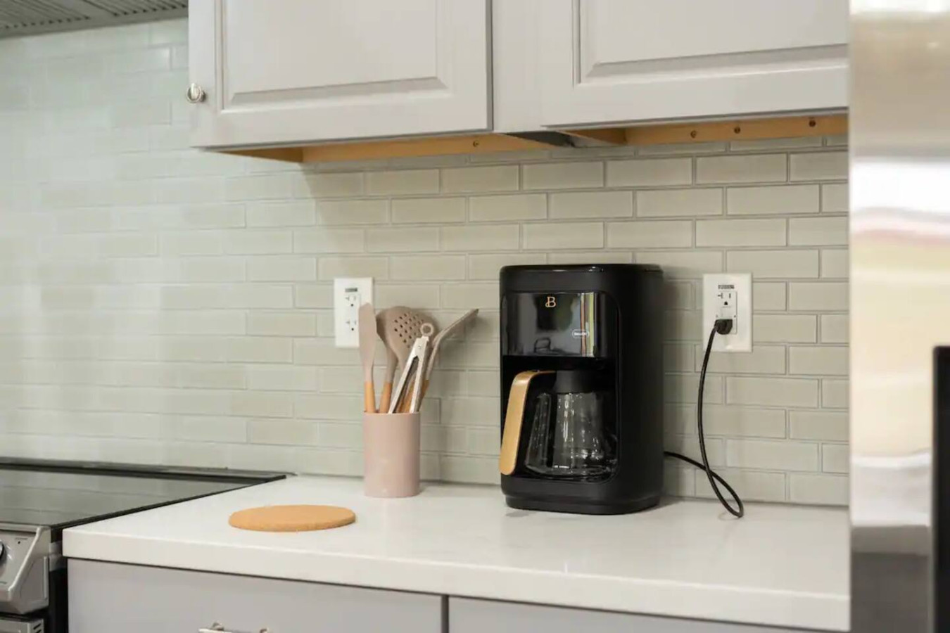 The coffee station is thoughtfully equipped with a variety of in-house consumables, including a selection of ground coffee, sweeteners, and creamers to suit every taste.
