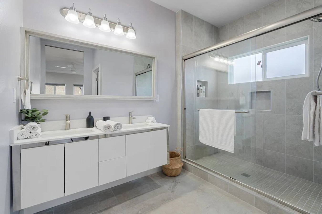 You feel a sense of calm as you enter the bathroom, where the thoughtful design and high-quality materials create a serene environment.