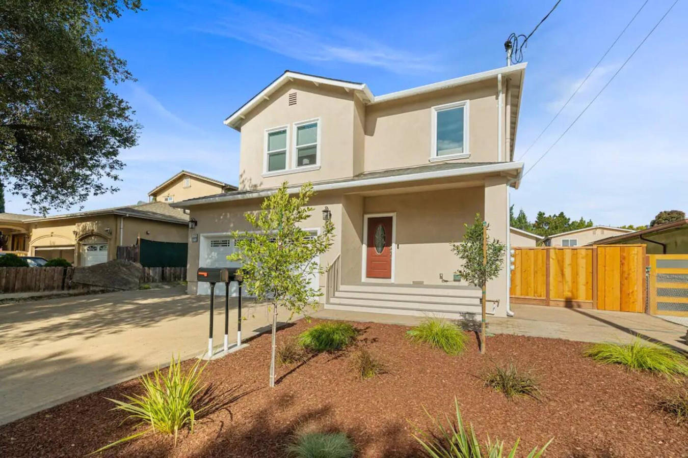 The house’s exterior is a blend of modern and classic design elements, creating a welcoming and stylish facade.