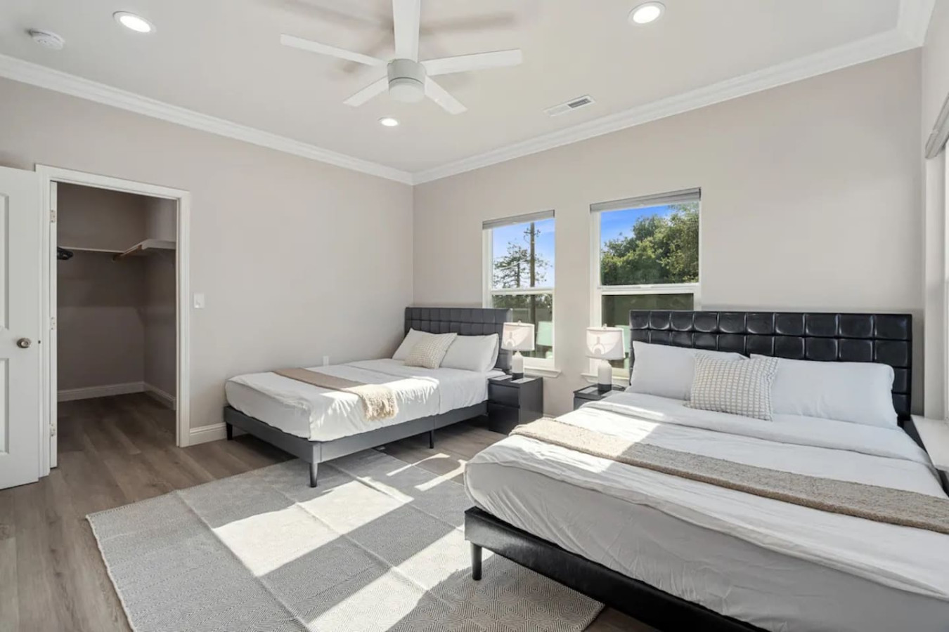 You feel enveloped in comfort as you relax on the queen bed, surrounded by a room designed for tranquility.