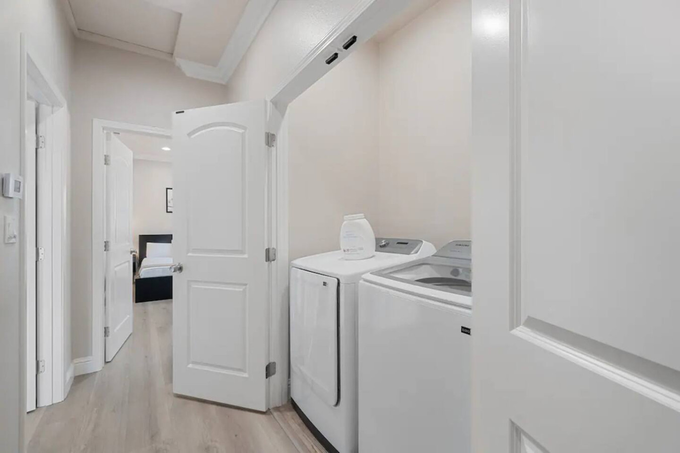 Convenient laundry room with washer, dryer, and all necessary supplies, making it easy to take care of your laundry needs.