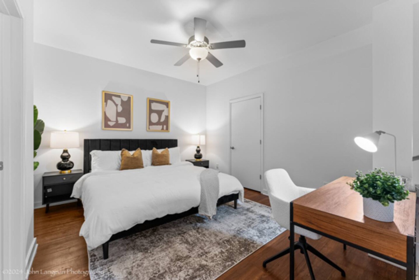 Rest easy in the master bedroom featuring a plush king-sized bed, vibrant decor, and ample natural light. The modern design and cozy ambiance create the perfect retreat for a peaceful night's sleep. Enjoy the comfort and tranquility of this inviting