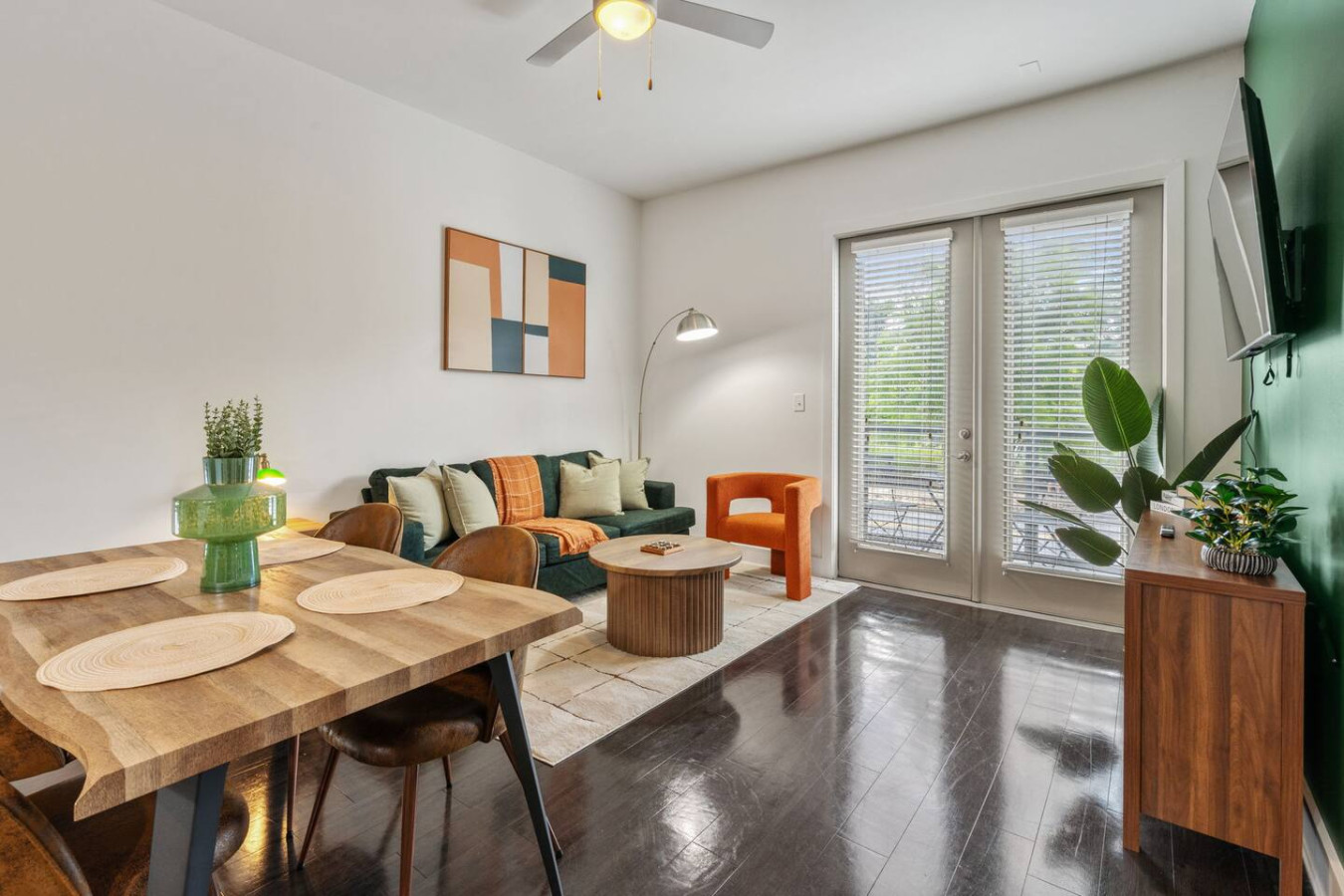 Open-concept living perfect for groups, with designer furnishings and private balcony access for morning coffee or evening relaxation