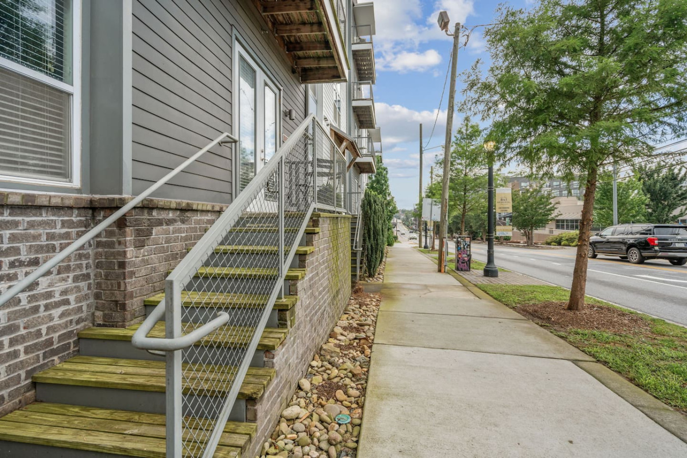 Your private entrance and balcony on a quiet, tree-lined street. Enjoy outdoor space while staying connected to the neighborhood.