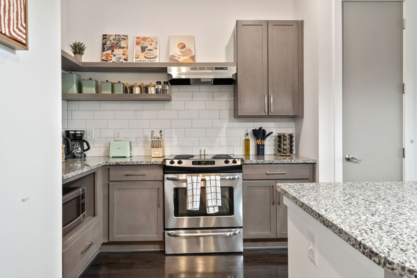 Fully equipped kitchen with stainless steel appliances, granite countertops, and everything needed for home cooking. Plus coffee station for perfect mornings.