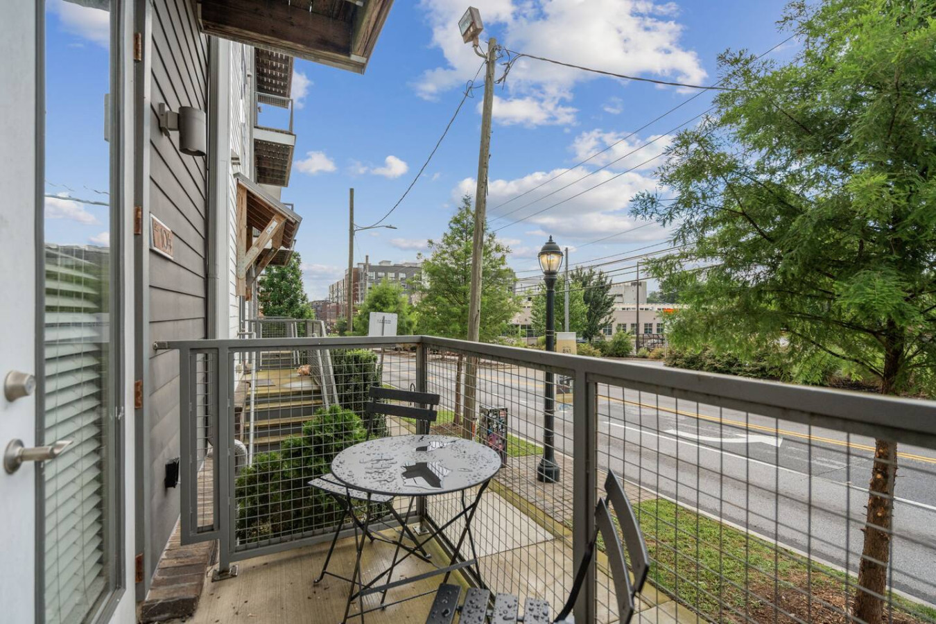 Your own outdoor retreat with cafe table and charming street views.