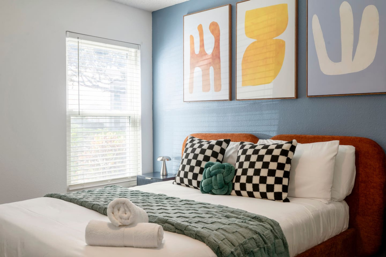 Bright and cheerful second bedroom with a comfy queen bed