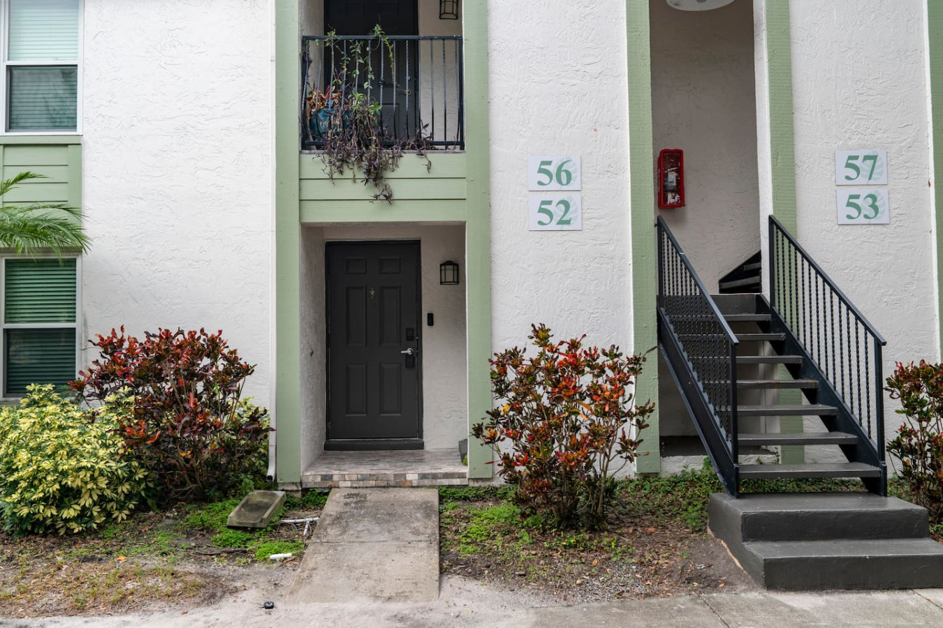 Ample guest parking surrounded by lush greenery