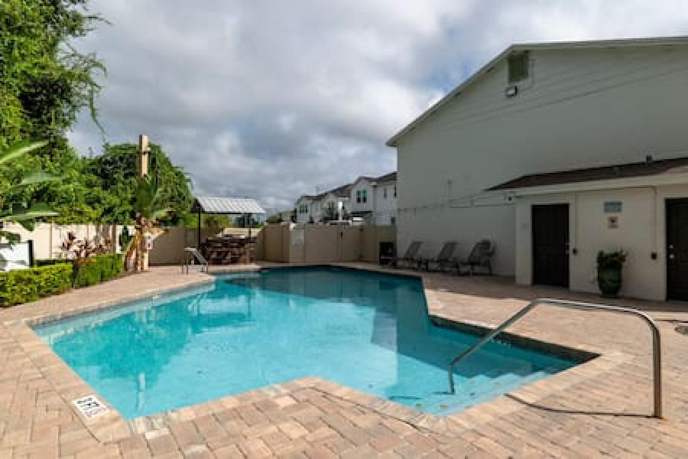 Spacious pool area with lounge seating for ultimate relaxation