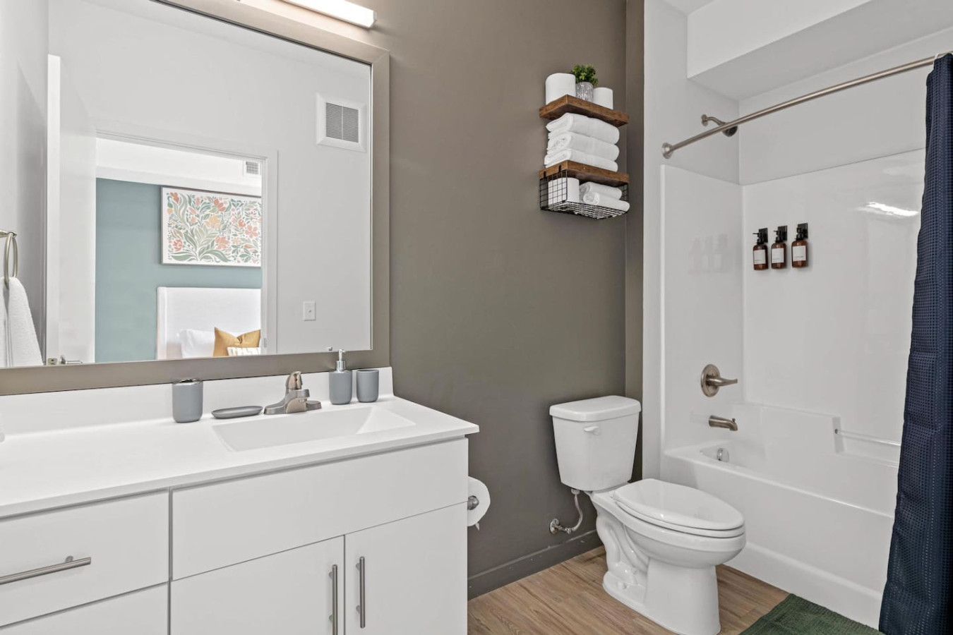 As you step into the bathroom, the clean lines and soothing colors create a space where you can relax and refresh.
