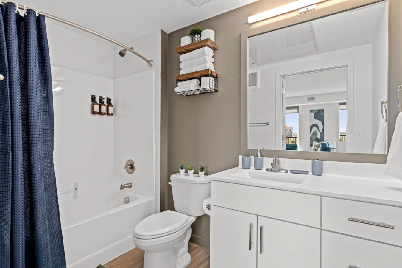 You feel a sense of calm as you enter the bathroom, where the thoughtful design and high-quality materials create a serene environment.