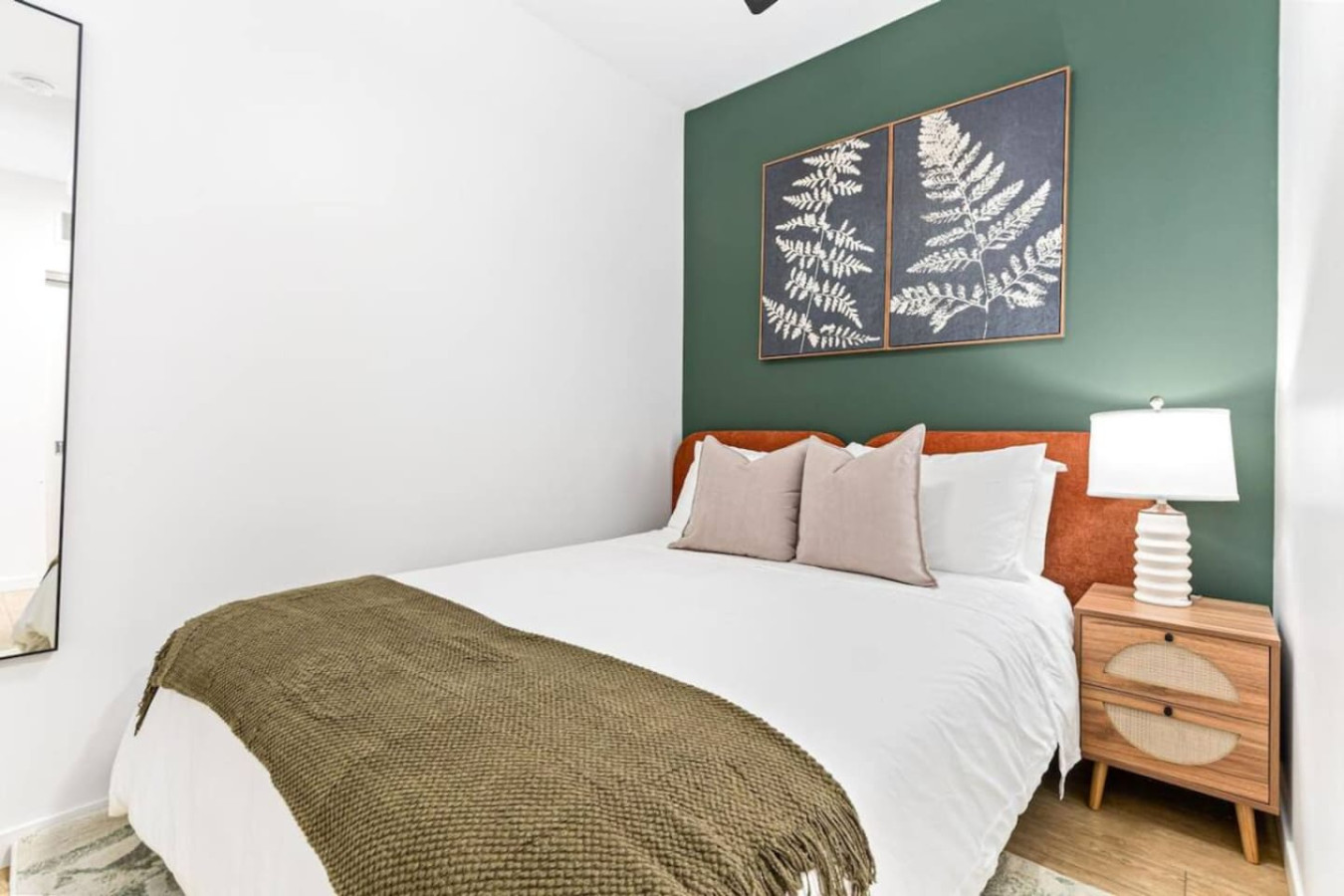 The bedroom offers a luxurious retreat, with a bed that promises restful nights and a room that feels like a private oasis.