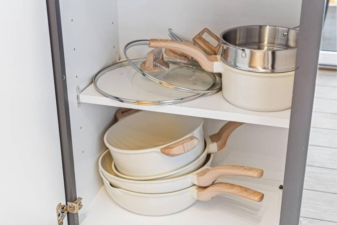 Kitchen cabinets stocked with cooking wares, glassware and silverwares, ideal for mixing up your favorite meals and drinks during your stay.