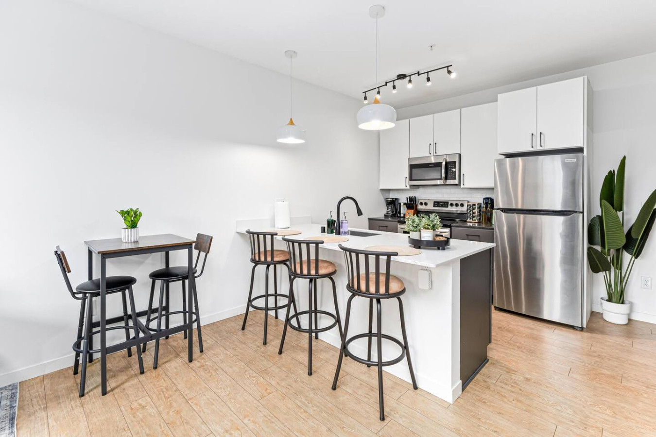 As you approach the home bar, the elegant layout and well-stocked shelves make it the ideal spot to relax.
