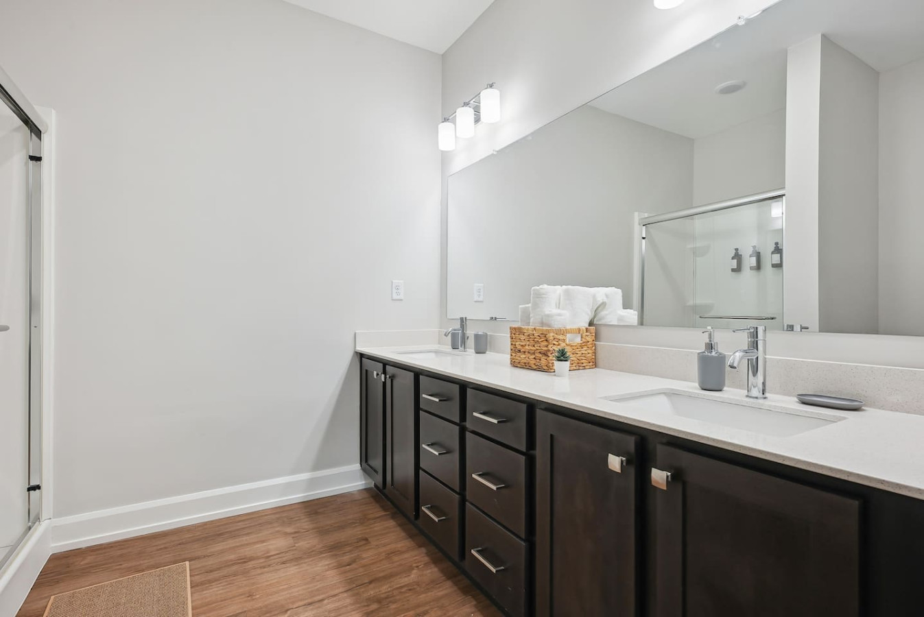 The bathroom is designed for comfort, with a spacious shower and elegant fixtures that make every moment feel luxurious.