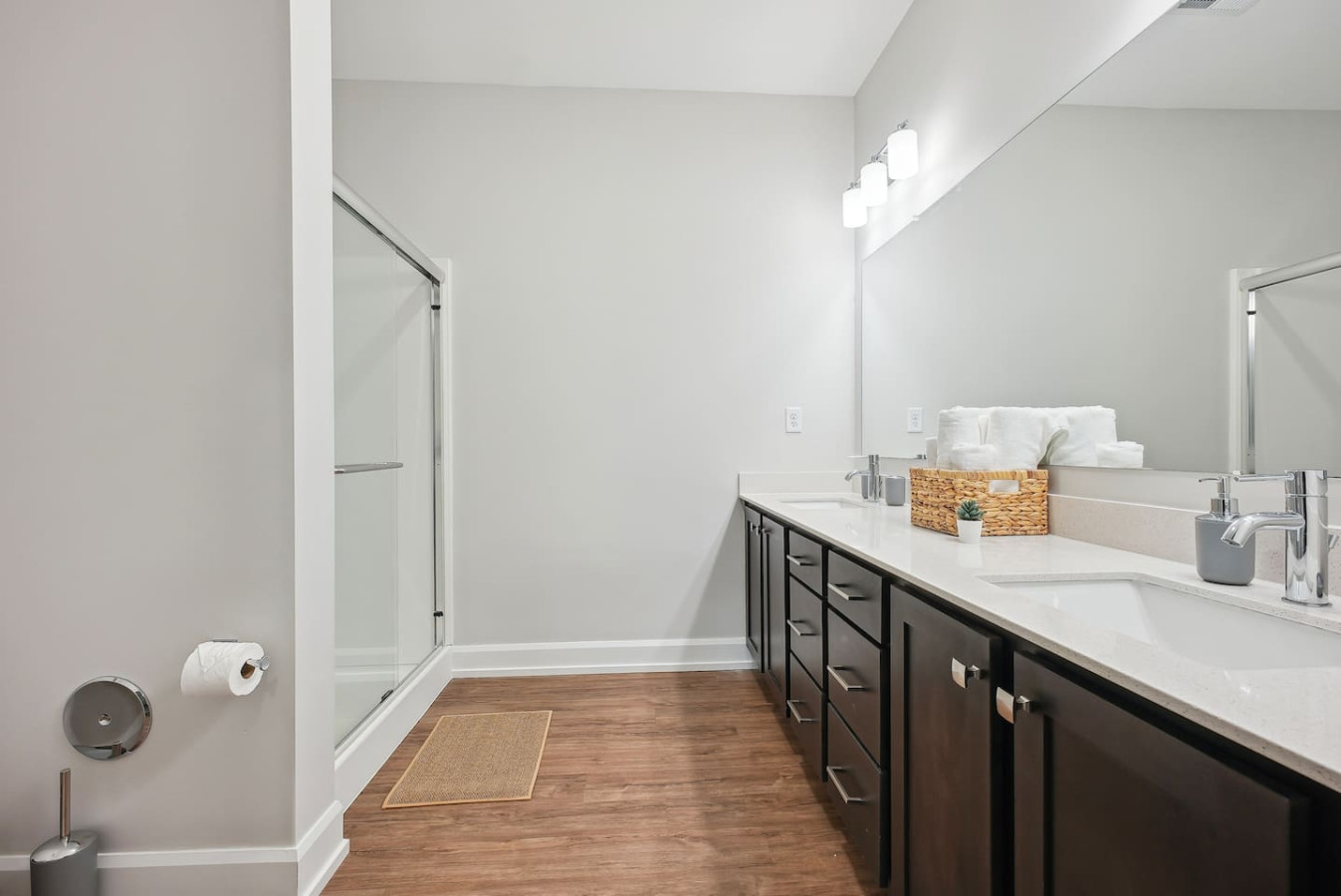 The bathroom is designed for comfort, with a spacious shower and elegant fixtures that make every moment feel luxurious.