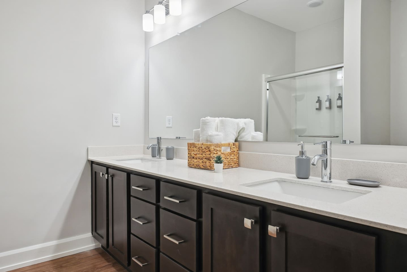 The bathroom is designed for comfort, with a spacious shower and elegant fixtures that make every moment feel luxurious.