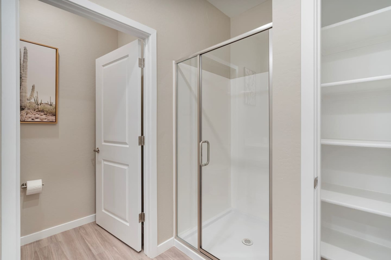 This bright and welcoming bathroom invites you to freshen up in comfort. Enjoy the forest-inspired shower curtain that adds a calming touch to your routine, complemented by the cozy rug underfoot and sparkling clean fixtures.