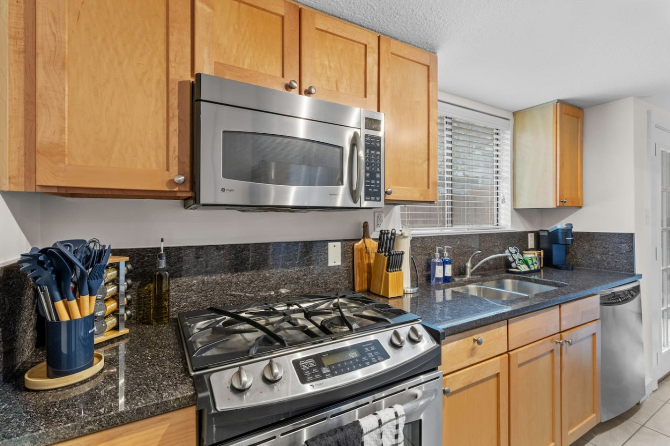 Fully equipped kitchen with gas range and modern appliances