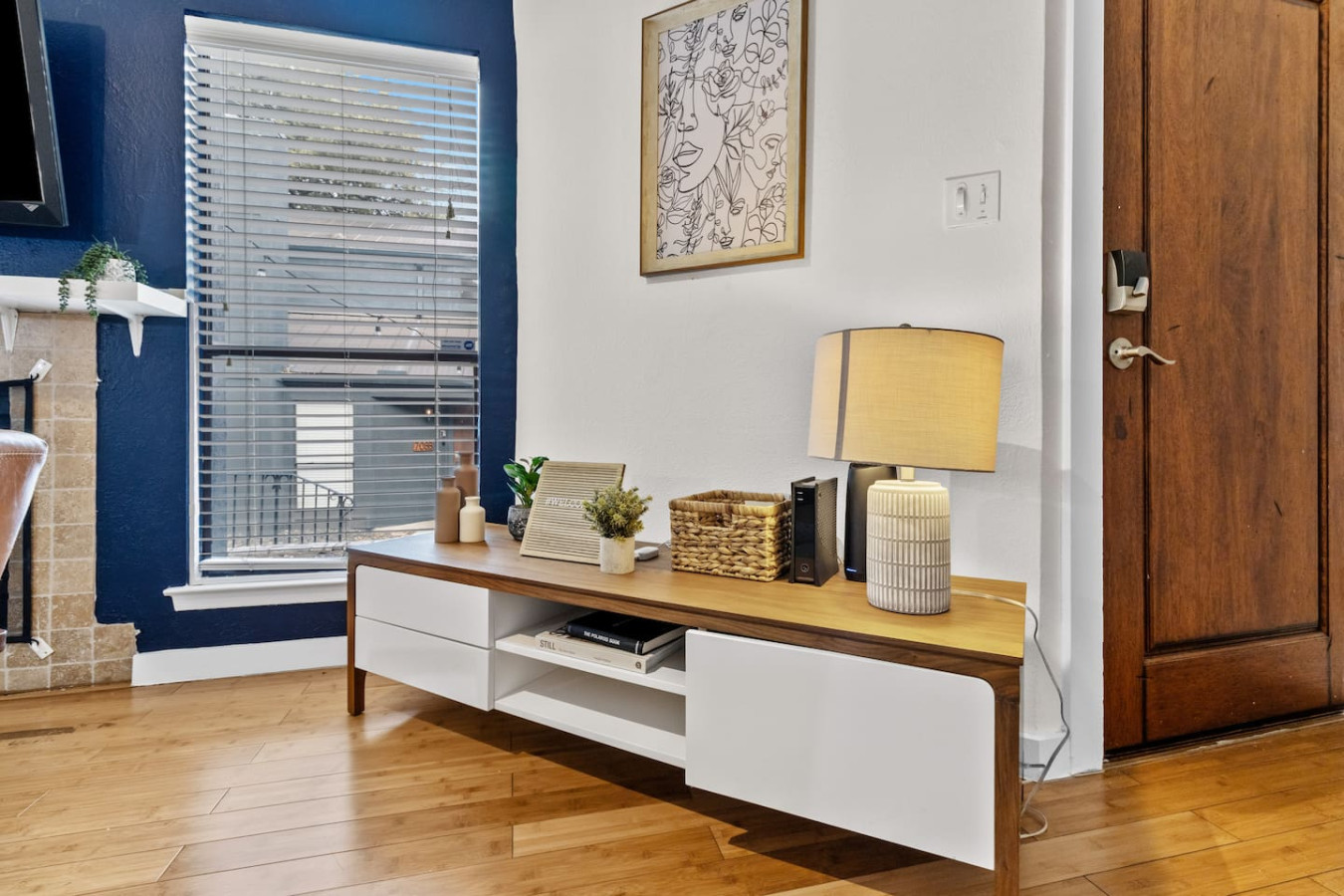 Sleek media console with warm lighting and clean design