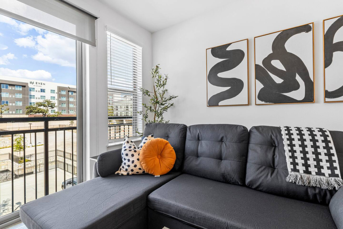 Take a seat in the living room, where cozy furniture and tasteful design create a relaxing atmosphere.