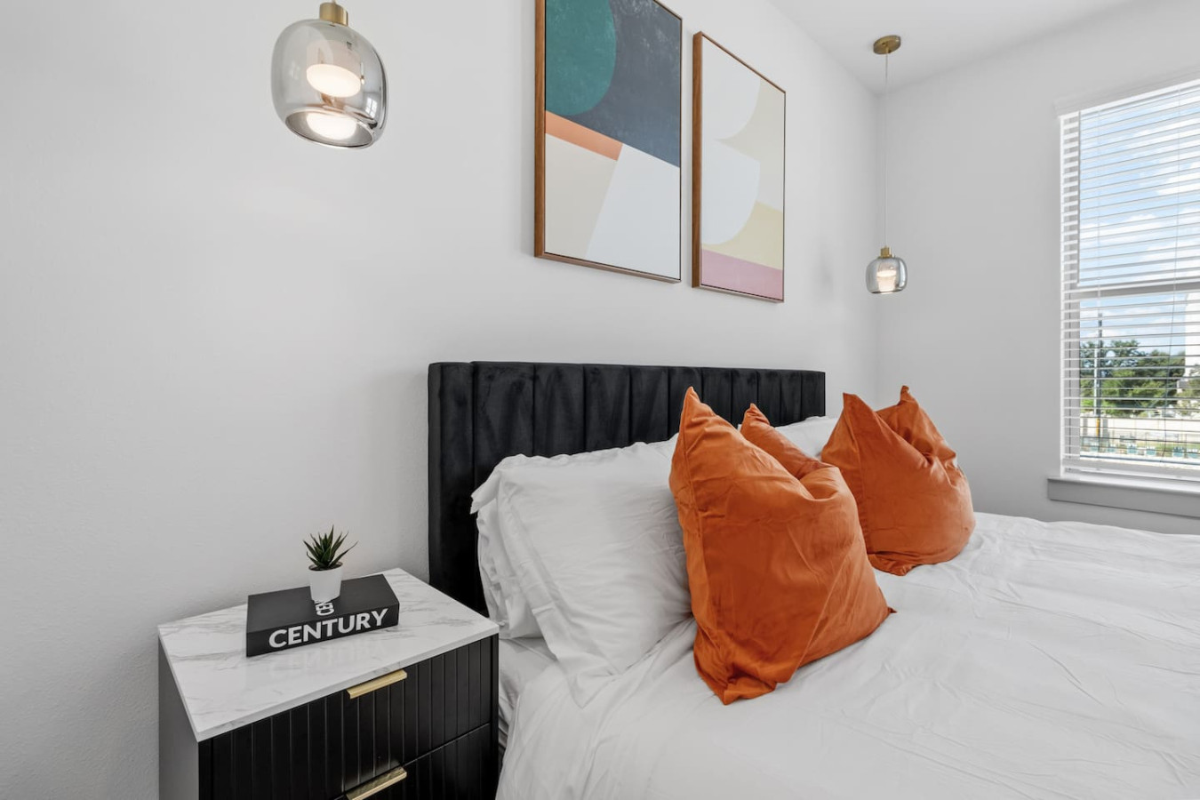 A haven of calm, the bedroom pairs a plush bed with an atmosphere made for ultimate relaxation.