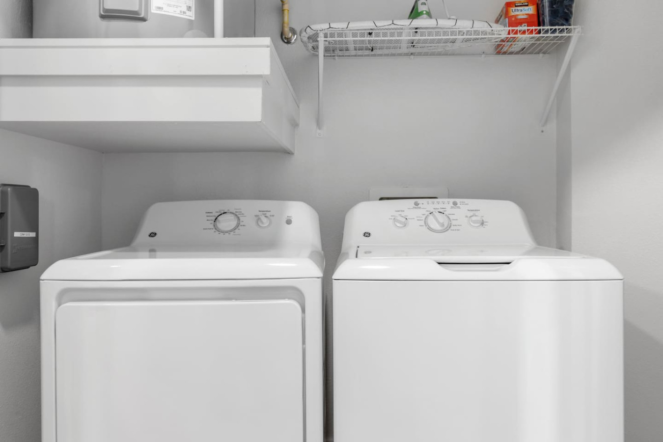 Equipped with modern machines and ample storage, this laundry room makes keeping things neat a total breeze.