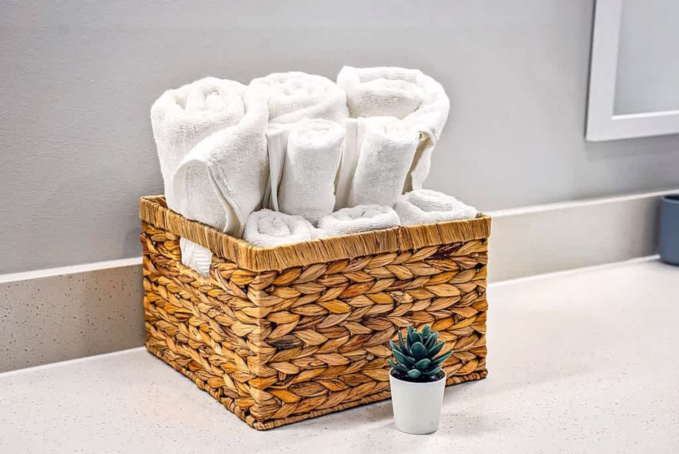 A bright bathroom featuring fresh rolled towels, modern finishes, and a clean countertop. Guests can enjoy a hotel quality feel with thoughtful touches that add comfort and convenience to their stay.
