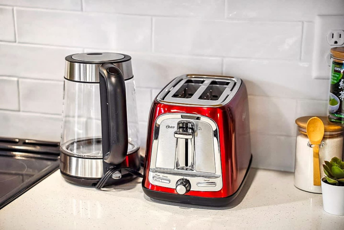 A well equipped countertop featuring a kettle, toaster, and food prep items. Perfect for quick breakfasts or snacks, giving guests the convenience of home during their stay.