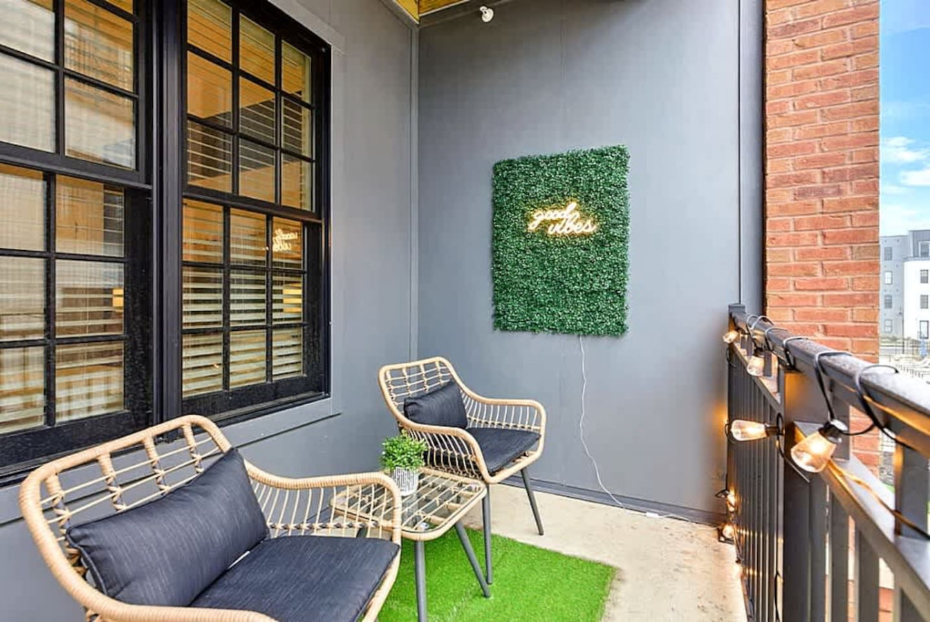 A cozy private balcony featuring stylish seating, soft lighting, and a touch of greenery for a relaxing outdoor vibe. Perfect for morning coffee, quiet reading time, or enjoying fresh air with beautiful courtyard views.