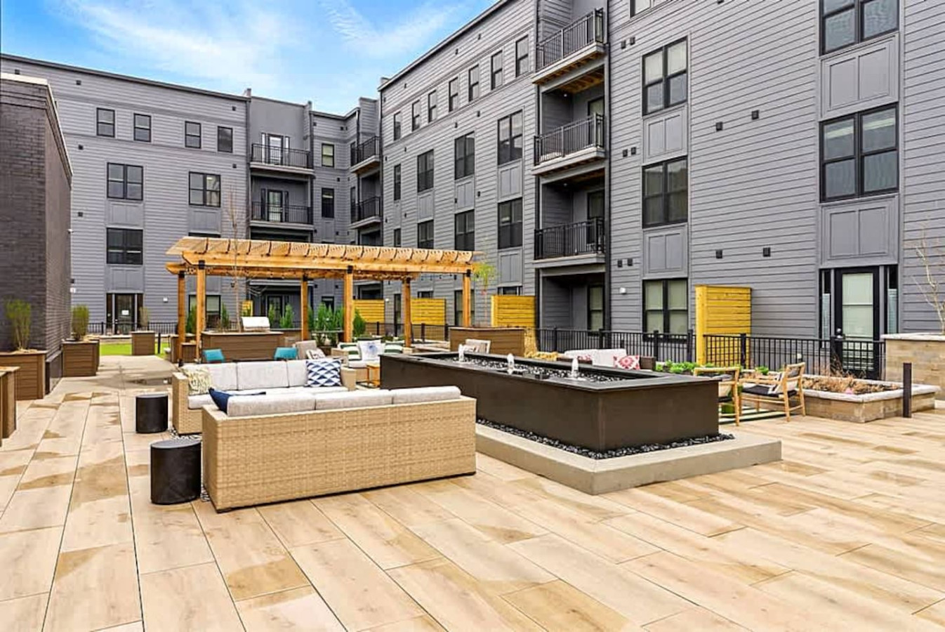 A stylish community patio offering lounge seating, modern decor, and an inviting outdoor ambiance. Perfect for gathering with friends, enjoying evenings outdoors, or relaxing in a well designed and comfortable shared space.