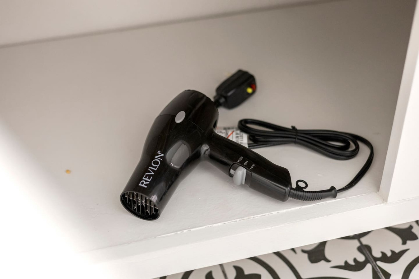 Hair dryer is provided and kept in the bathroom closet.