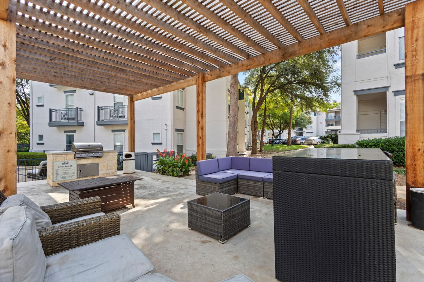 Outdoor area with a barbecue and a shared patio, perfect for enjoying meals and fresh air.