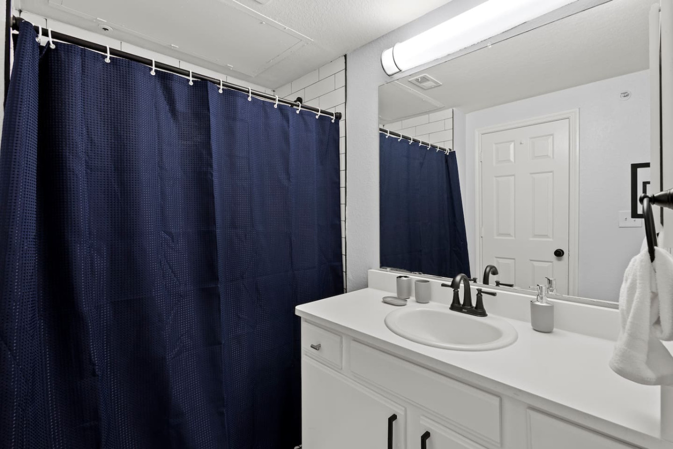 "Full bathroom equipped with a shower, toilet, sink, and all essential toiletries for a comfortable stay."