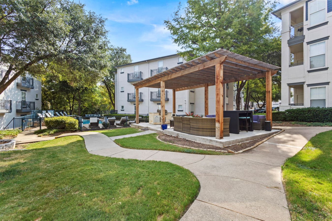 "Outdoor area with a barbecue and a shared patio, perfect for enjoying meals and fresh air."