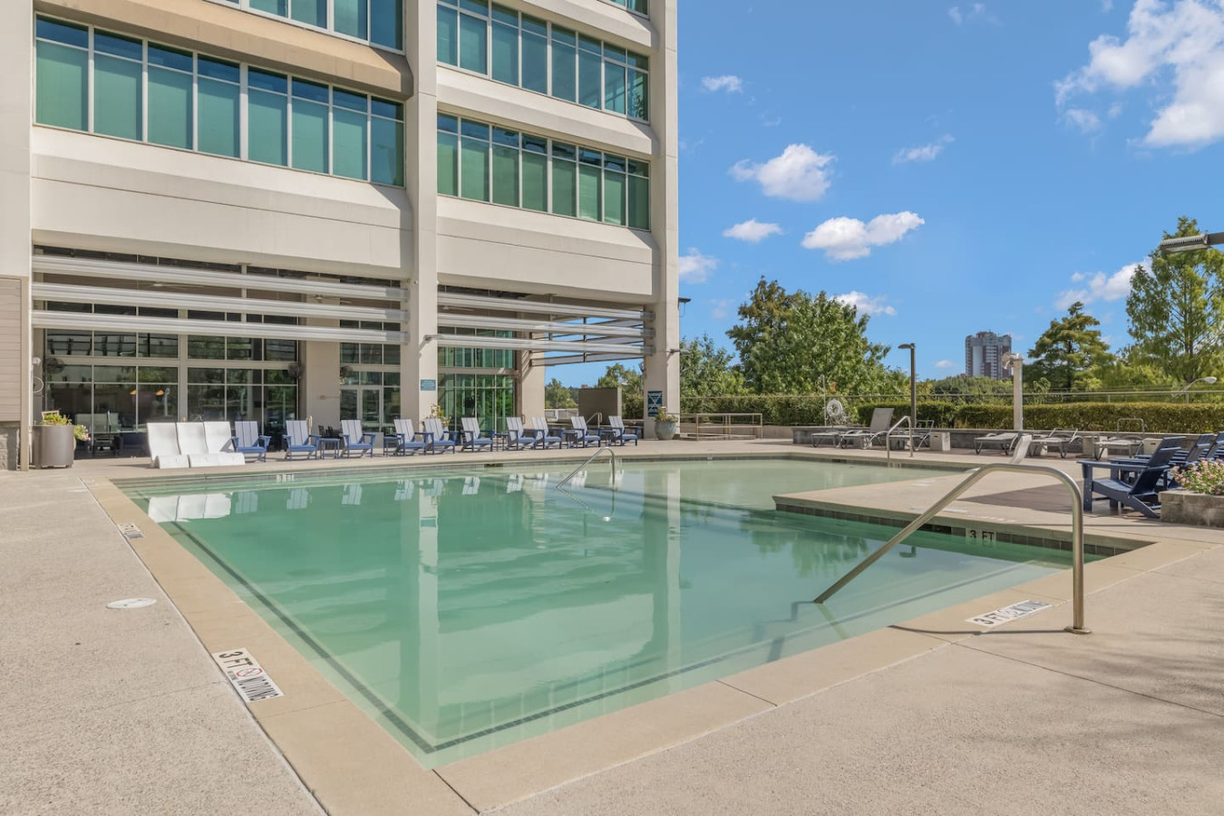 Resort-style rooftop pool with lounge chairs and city views — available to all guests. Cool off on a warm Atlanta day or soak up the sun just steps from your front door.