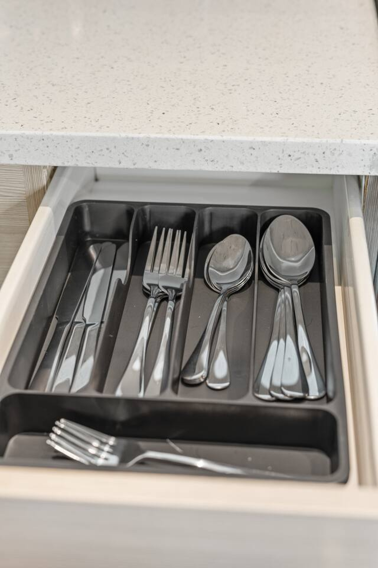 Kitchen comes fully stocked with organized silverware — knives, forks, and spoons for all your dining needs. Everything you need to enjoy a home-cooked meal without packing a thing.