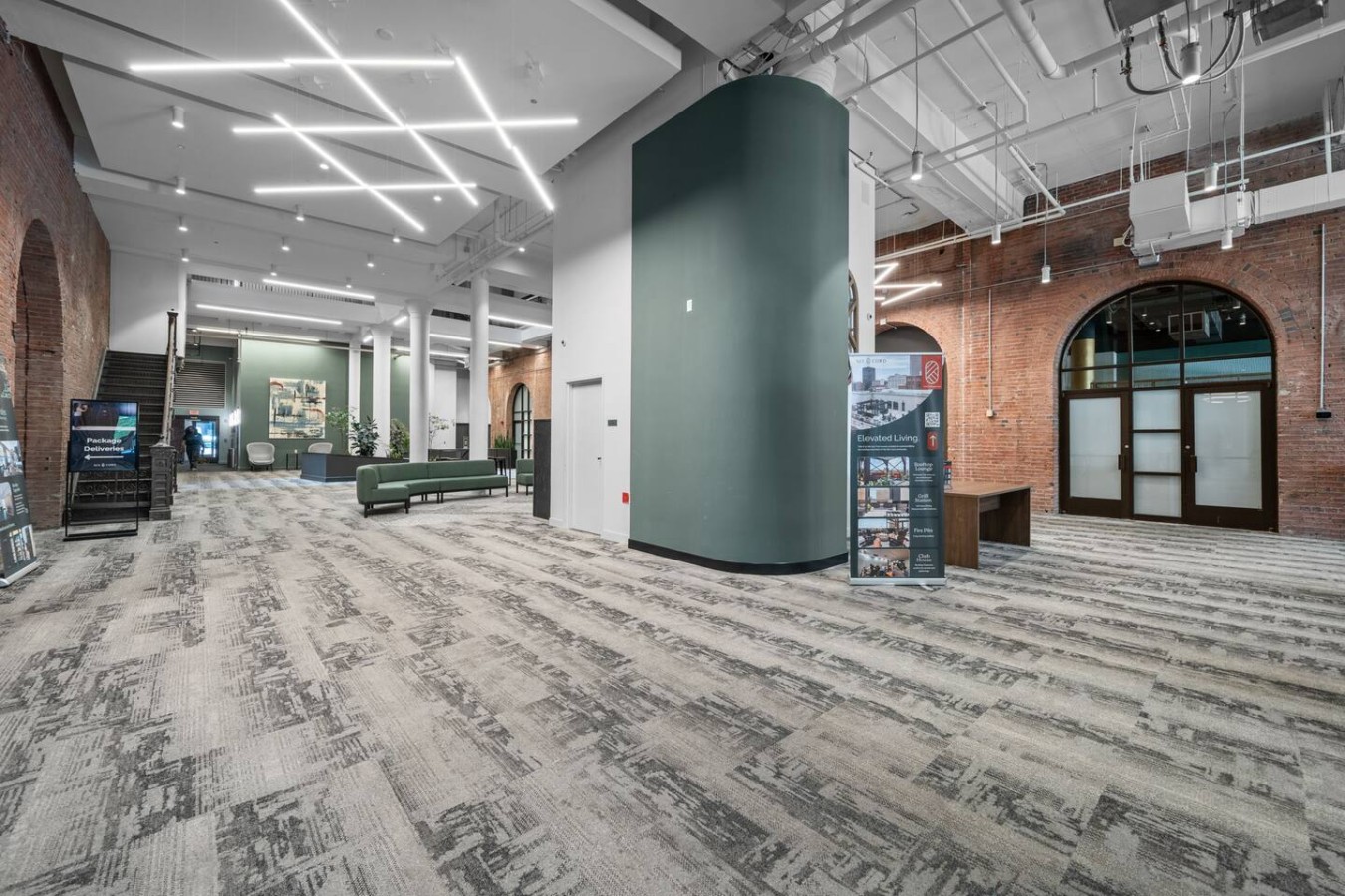 Spacious reception area with seating and sofas.
