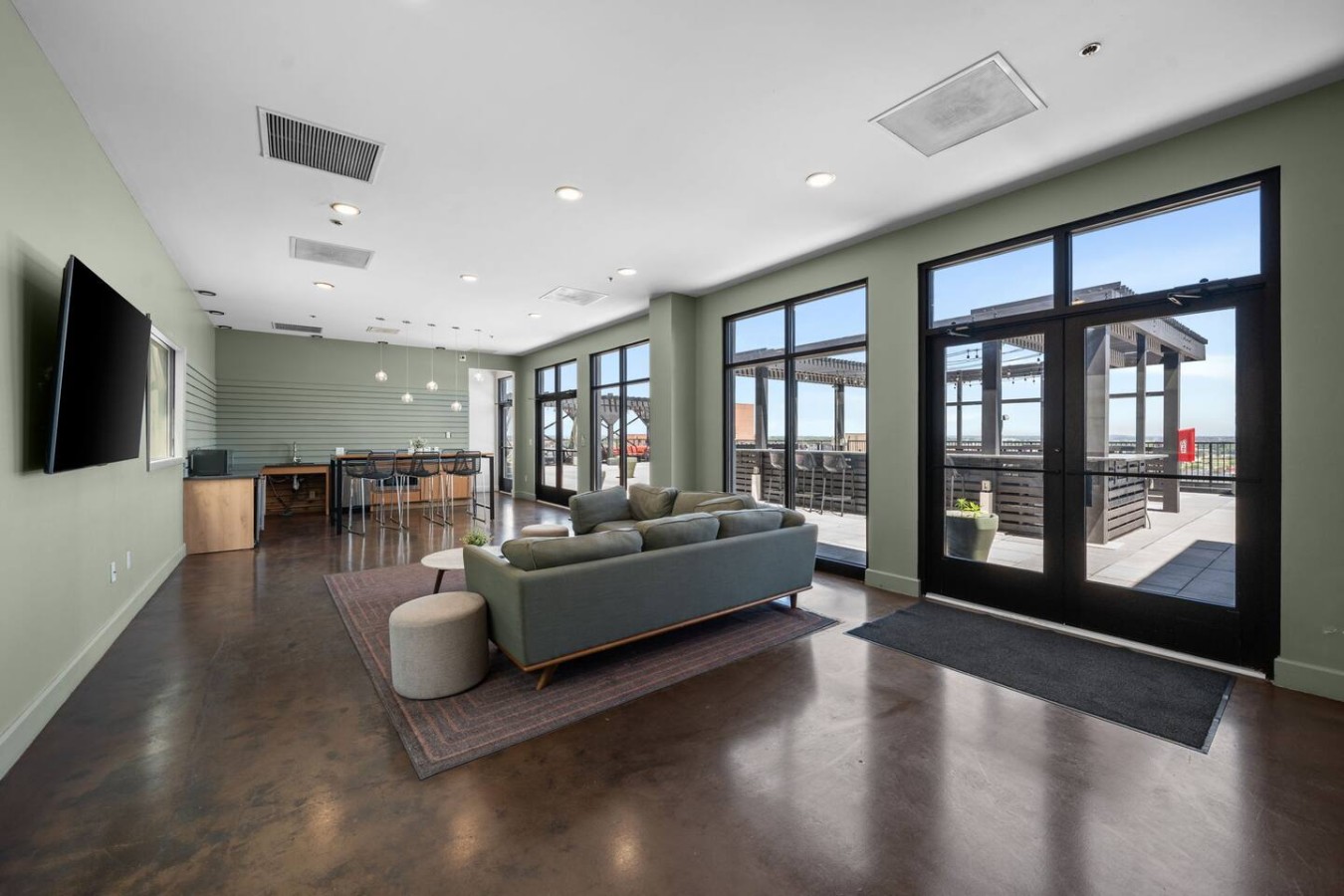 Communal lounge area at roof level. TV and kitchennete.